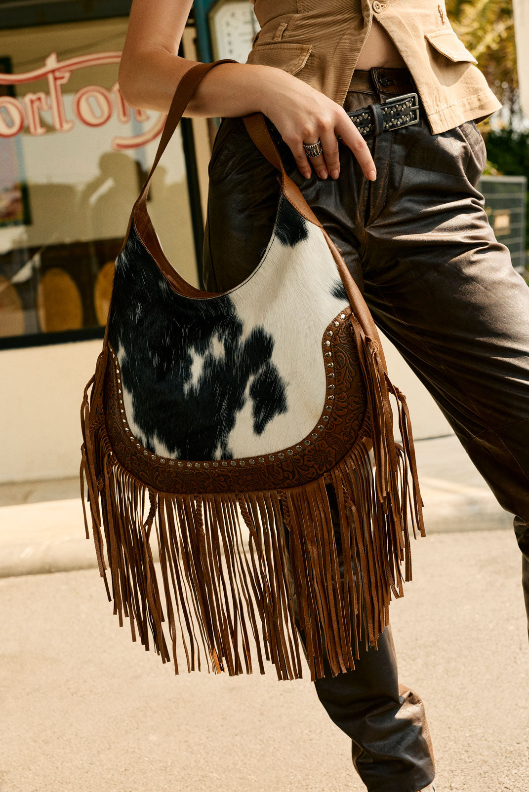 Myra Lasso Lane Hairon Leather Bag for Women in brown with fringe and embossed detail